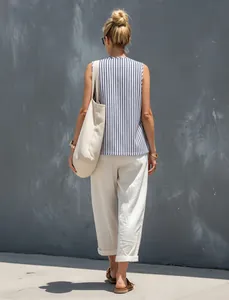 Back view of a woman wearing a blue and white striped vest and beige wide-leg pants set