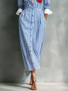 Detailed view of blue and white striped shirt dress featuring a contrasting red breast pocket.