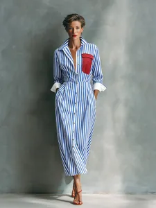 French style blue and white striped shirt dress with a red contrast pocket detail.