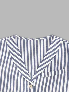 Close-up detail of the v-neck and striped linen fabric on this French style vest set