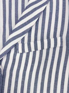 Macro detail showing the texture of blue and white striped fabric on a French style vest