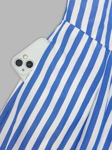 Close-up detail showing a functional pocket on this elegant blue and white striped dress
