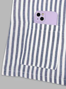 Close-up detail of a functional pocket on this French blue and white striped vest garment