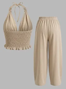 Boheemse beige linnen tweedelige set met haltertop en losse baggy lantaarnbroek