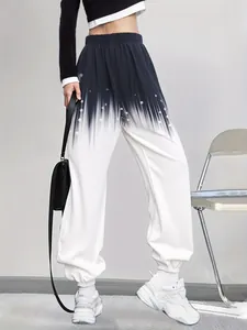 Detail view of women's loose knit sweatpants with stylish black and white ombre print