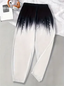 Detailed view of women's comfortable black and white gradient print sweatpants with a loose fit