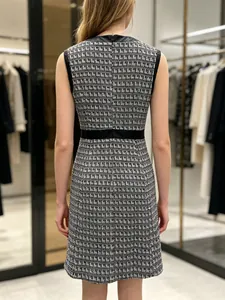 Back view detail of a French vintage houndstooth tweed dress with black leather trim