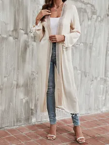 Beige long-sleeved crochet trim cardigan with white tassels for women's beach cover up