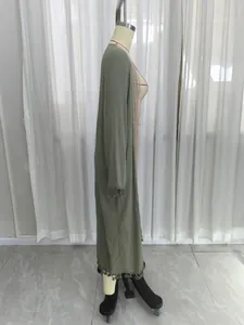 Women's long sage green loose cardigan featuring lace trim and tassels for beach cover-up