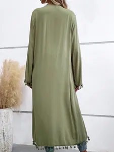 Elegant back view of long sage green beach cover-up with stylish tassel trim details