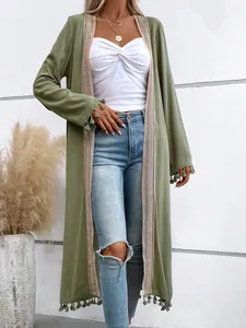 Close-up detail of olive green long sleeve cardigan with elegant tassel and lace trim