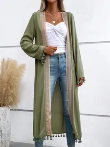 Macro view of olive green long cardigan featuring elegant tassel hem and lace trim