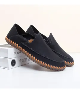 Close-up detail of handmade black leather loafers with stitched soft rubber sole