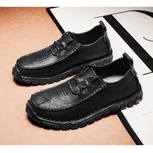 Detail view of men's black textured leather casual shoes with soft anti-slip soles