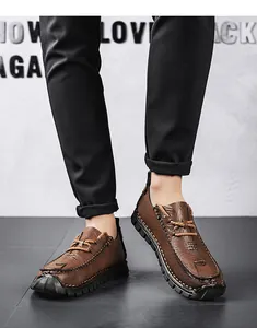 Close-up detail of brown men's outdoor casual leather shoes with anti-slip soft soles