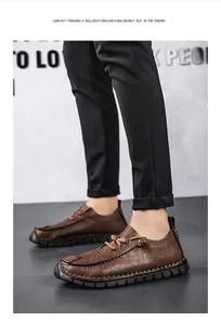 Close-up of men's brown textured leather casual shoes with lace-up detail.