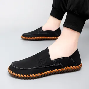 Men's black casual moccasin loafers with orange hand-stitched detailing and soft soles