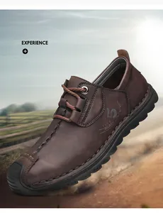 Zijaanzicht van bruine leren heren schoenen met grove stiksels en een stevige rubberen zool.