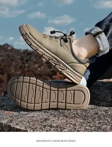 Close-up of durable non-slip sole and rugged design on men's khaki outdoor hiking shoes