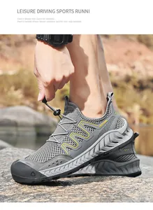 Dettaglio di scarpe da trekking da uomo in mesh grigio traspirante con sistema quick-lace