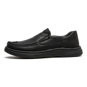 Detail view of black slip-on loafers for men with soft rubber sole and leather texture.