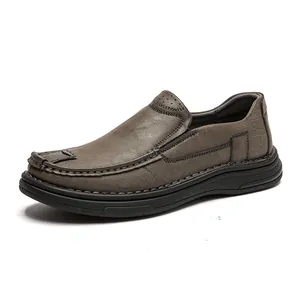 Close-up of men's casual grey leather slip-on loafers with soft rubber sole