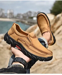 Detail view of men's tan nubuck leather slip-on loafers featuring a durable anti-slip sole