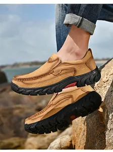 Detailed side view of men's tan nubuck leather casual outdoor loafers with anti-slip soles