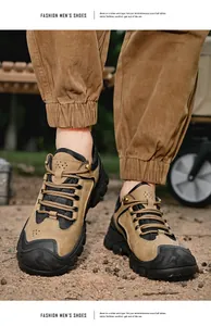 Chaussures de randonnée pour hommes kaki et noir sur un terrain poussiéreux