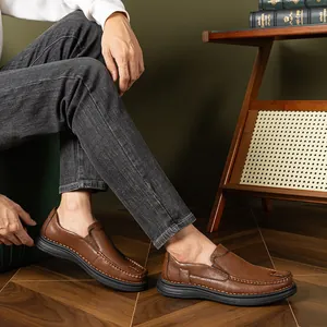 Premium brown men's slip-on loafers featuring soft soles and hand-stitched detailing