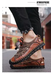 Detail view of stylish brown breathable leather men's outdoor sports sandals on street.