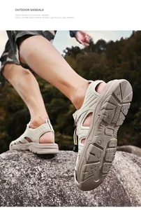 Detailed view of men's breathable closed-toe outdoor sandals on a rocky mountain trail