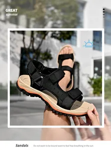 Close-up of men's outdoor sandals featuring black velcro straps and tan soles