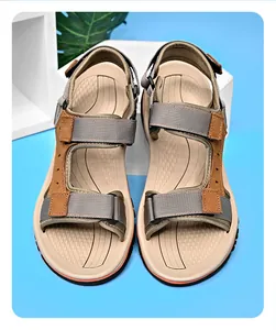Top-down view of premium men's outdoor sandals with brown leather straps and Velcro