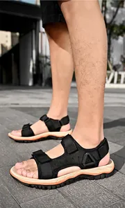 Close-up view of black outdoor sandals with thick sole for men's summer hiking.