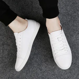 Classic men's low-top white leather sneakers with soft sole for casual daily wear.