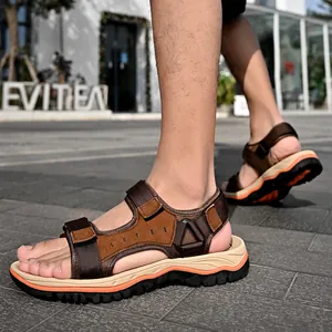 Men's brown leather outdoor sandals with non-slip sole and adjustable velcro straps.
