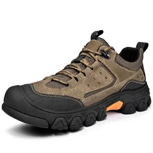Side view detail of a durable men's brown hiking shoe with reinforced rubber toe