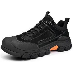 Detailed view of durable men's black outdoor hiking sneakers featuring rugged soles