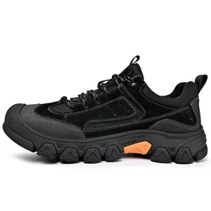 Side view of black outdoor hiking shoes with rugged rubber soles
