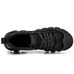 Top view of men's black outdoor hiking shoes featuring rugged soles and breathable mesh texture.