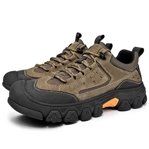 Detailed side view of men's durable brown suede outdoor hiking shoes with lug sole