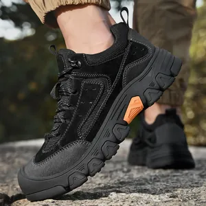 Close-up view of men's black outdoor hiking shoes with durable chunky anti-slip soles
