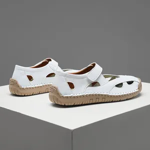 Detail view showing side and rear of white leather hollow casual nursing loafers