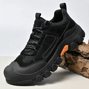 Detailed side profile of black men's outdoor hiking shoes with rugged anti-slip sole