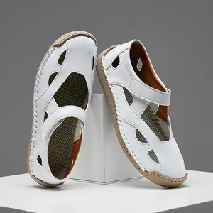 Side view showing the hollow-out texture and leather finish of white women loafers.