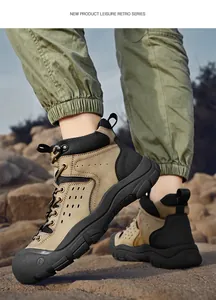 Rugged khaki hiking boots for men in a rocky outdoor terrain.