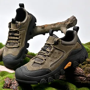 Close-up detail of rugged brown men's hiking sneakers on natural mossy terrain backdrop