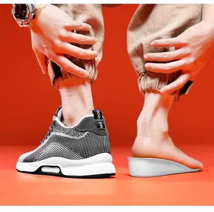 Detail view of 6cm invisible height increasing insole in grey breathable sneakers.