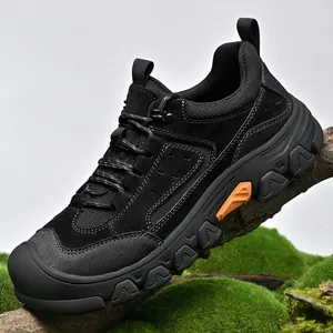 Black men's outdoor hiking shoes on a mossy branch, rugged non-slip sole trekking sneakers